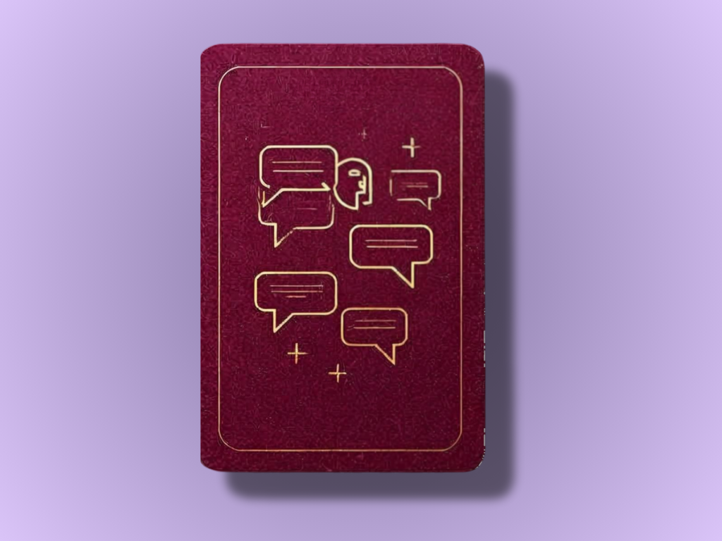 The Queen of Cups tarot card showing a woman sitting by the sea with a golden, lidded chalice.